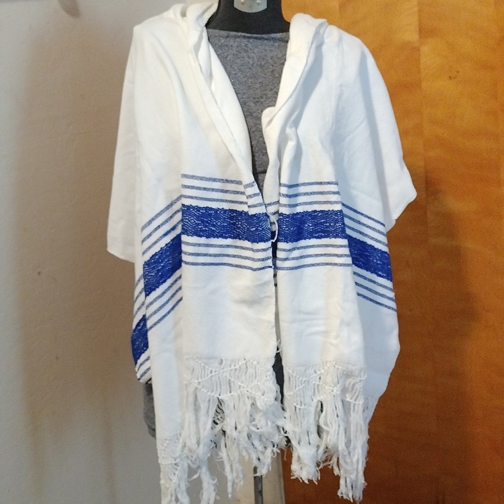 Handmade white rebozo woven on a loom. From Oaxaca crafts.